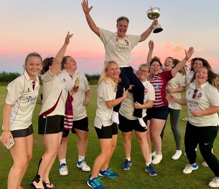 Skipper Lucy celebrates winning the league as skipper